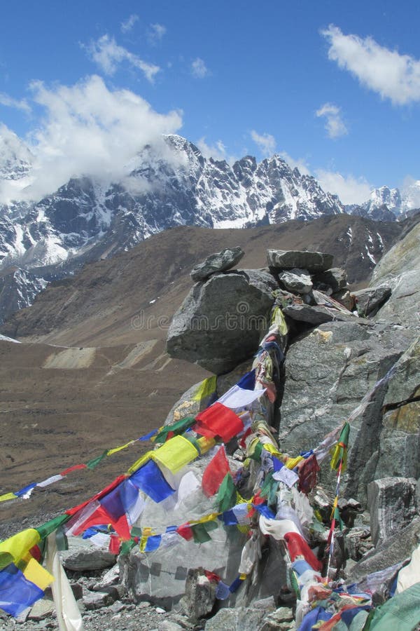 Prayer flags in Nepal trekking at Himalaya mountains stock photo Prayer flags in Nepal trekking at Himalaya mountains stock photo