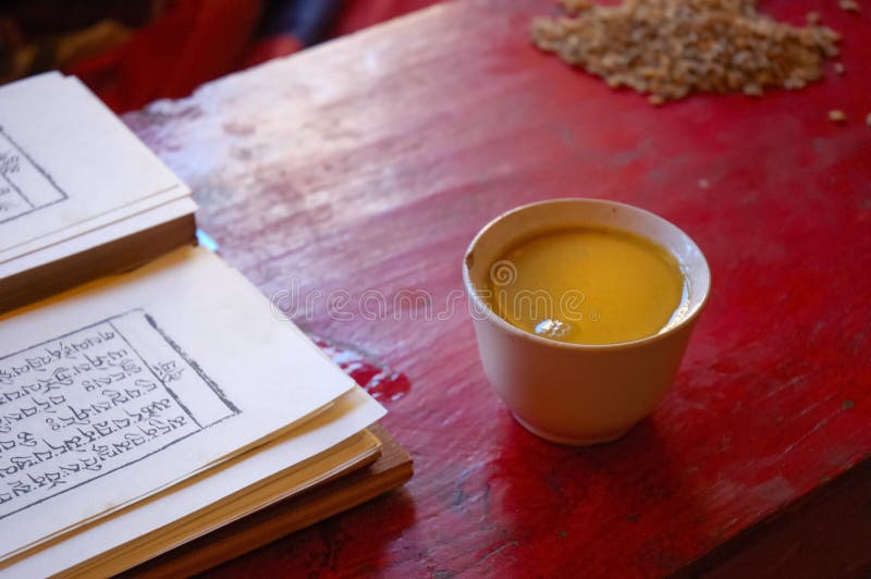 Tibetan prayer book and salt tea royalty free stock images