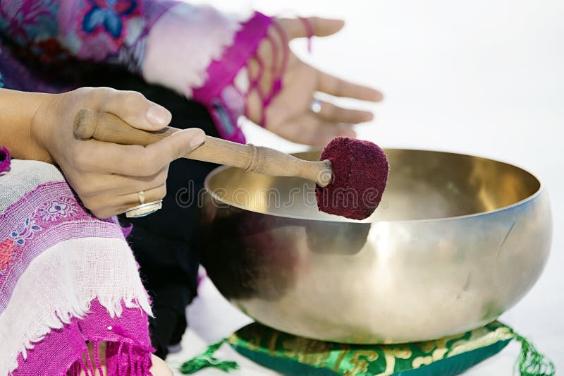 Tibetan Singing Bowl Being Played stock photo Tibetan Singing Bowl Being Played stock photo