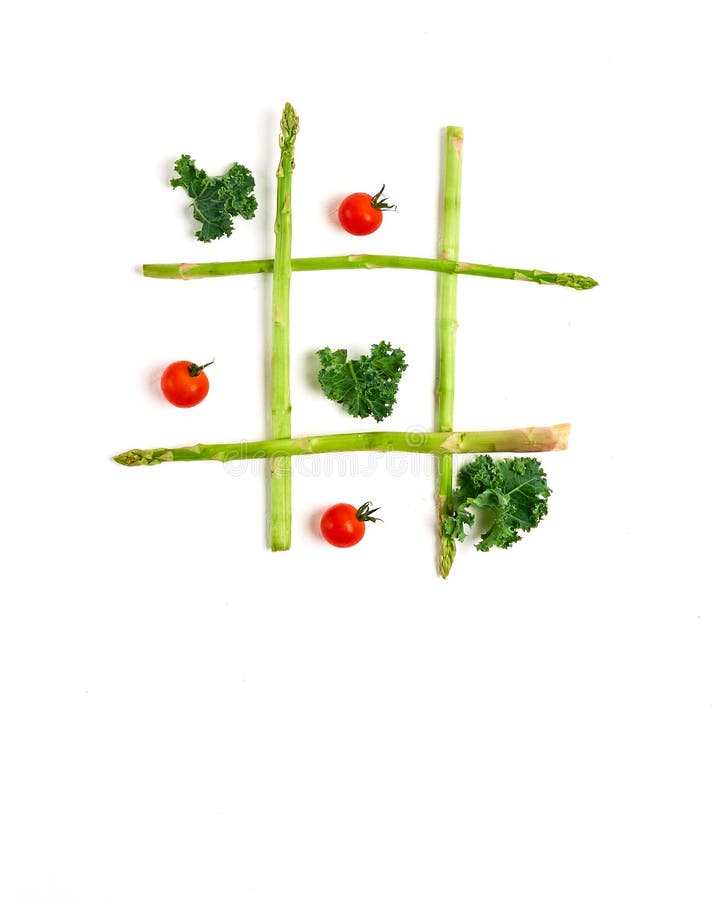 tic tac toe with food, asparagus kale, tomato, top view stock photos tic tac toe with food, asparagus kale, tomato, top view stock photos