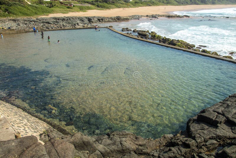 Tidal Pool Against Beach and Coastal Residential Buildings Lands