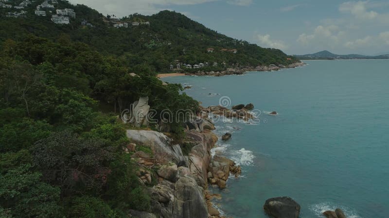 Tide beach stones blue sea ocean bay nature thailand coast palms and rocks