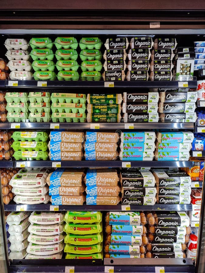 Tidy Display of Different Brands of Organic Eggs Editorial Image