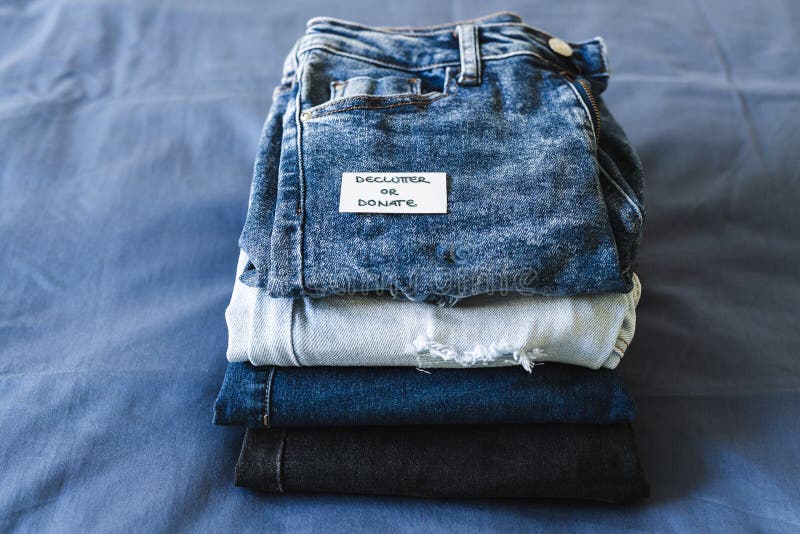 Declutter and Donate Label on Different Jeans in Various Denim Colors ...