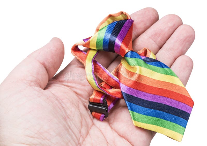Tie in the colors of the rainbow in her hand royalty free stock photo Tie in the colors of the rainbow in her hand royalty free stock photo