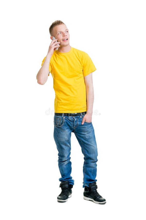 Teenage boy talking on the phone isolated on white. Teenage boy talking on the phone isolated on white.