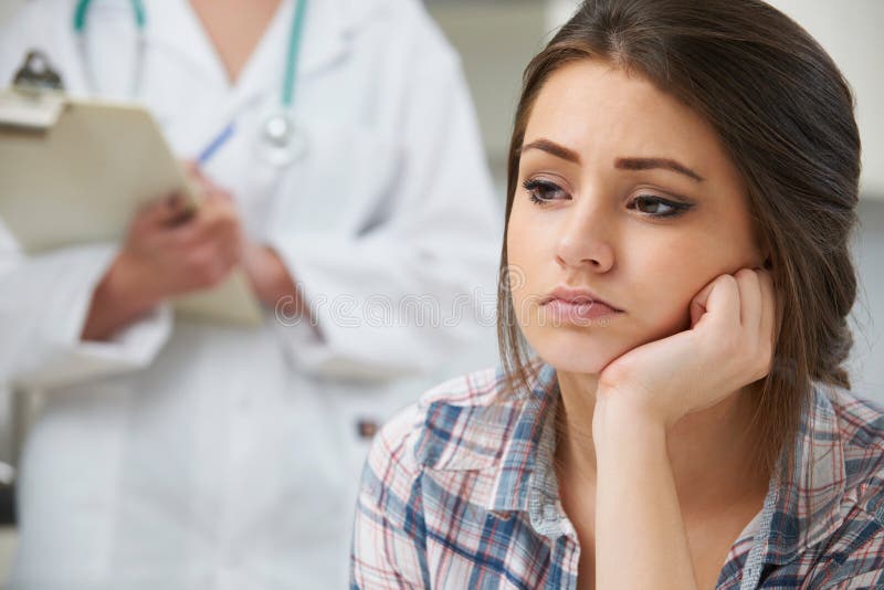 Tiener met Benoeming bij de Chirurgie van de Arts royalty-vrije stock afbeelding Tiener met Benoeming bij de Chirurgie van de Arts royalty-vrije stock afbeelding
