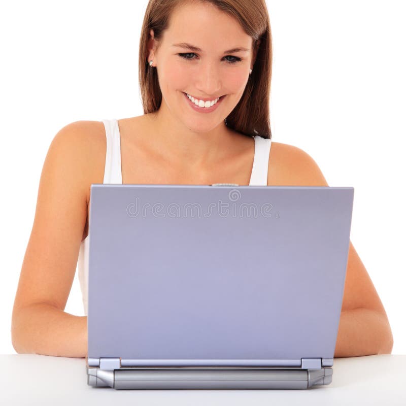 Attractive teenage girl using laptop. All on white background. Attractive teenage girl using laptop. All on white background.