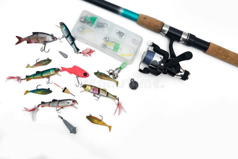 Spinning rod, reel and fishing baits isolated on white background, top view. Spinning rod, reel and fishing baits isolated on white background, top view