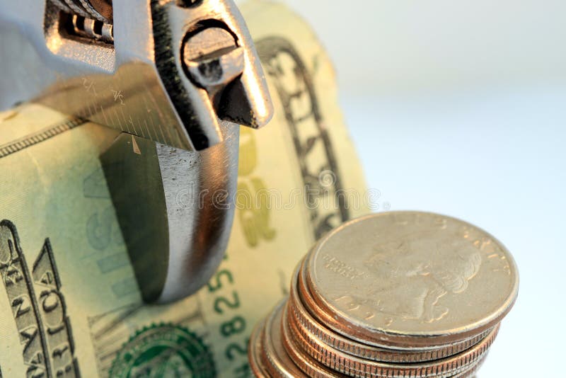 Tighten Budget & Savings. Symbol of budget shrink and tighten your budget. This photo conveys financial management concepts such as, inflation, budget reduction royalty free stock images Tighten Budget & Savings. Symbol of budget shrink and tighten your budget. This photo conveys financial management concepts such as, inflation, budget reduction royalty free stock images