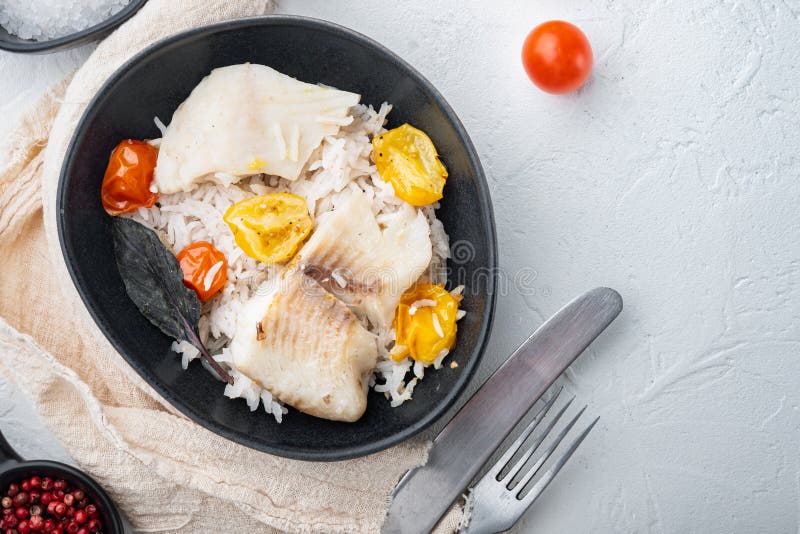 Tilapia Fish with Basmati Rice and Cherry Tomatoes in Bowl, on White