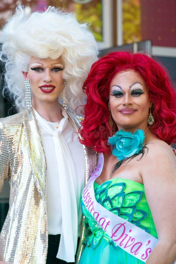 Tilburg, Netherlands - 22.07.2019: couple of transgender man in spectacular costumes at Roze Mandaag pink monday - gay, lgbt pride day in Netherlands. Tilburg, Netherlands - 22.07.2019: couple of transgender man in spectacular costumes at Roze Mandaag pink monday - gay, lgbt pride day in Netherlands