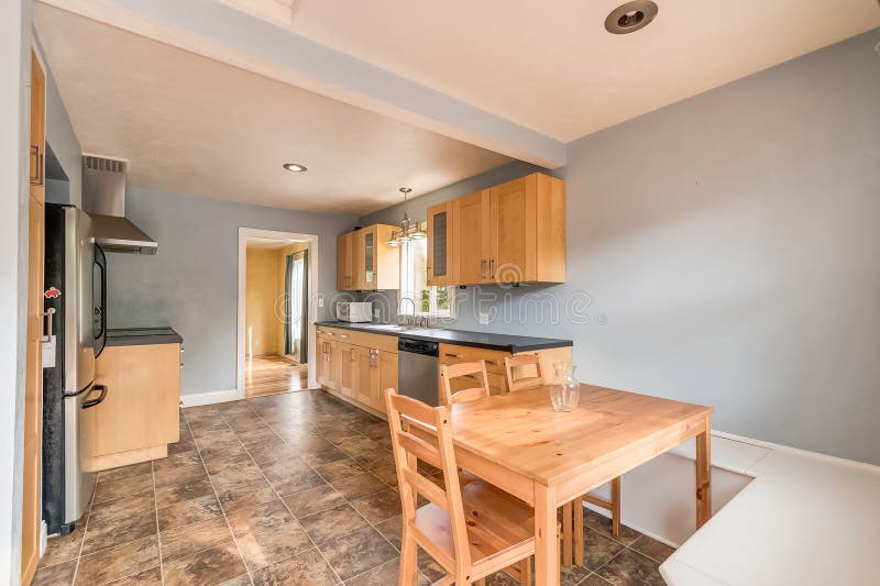 Tile Floor Kitchen Wood Table Wood Blue Walls Stock Image
