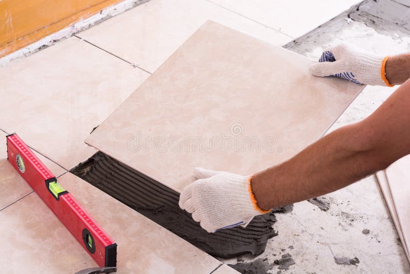 Tiler installing ceramic tiles stock photography Tiler installing ceramic tiles stock photography
