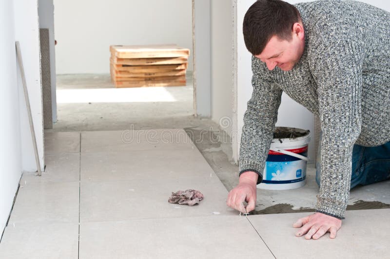 Tiler på arbete arkivfoton Tiler på arbete arkivfoton