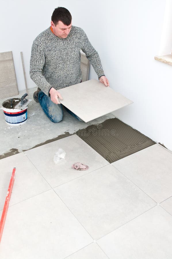 Tiler på arbete royaltyfria foton Tiler på arbete royaltyfria foton