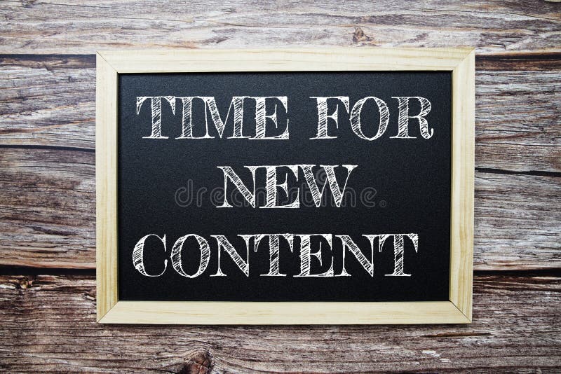 Tim for New Content Word with Alarm Clock on Wooden Background Stock