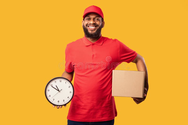 African Courier Holding Parcel and Clock Posing Over Yellow Background Stock Photo Image of