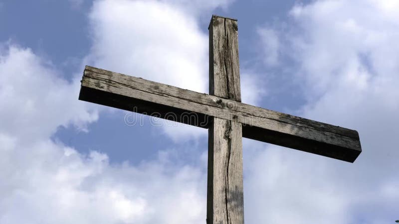 Time laps wooden cross with clouds