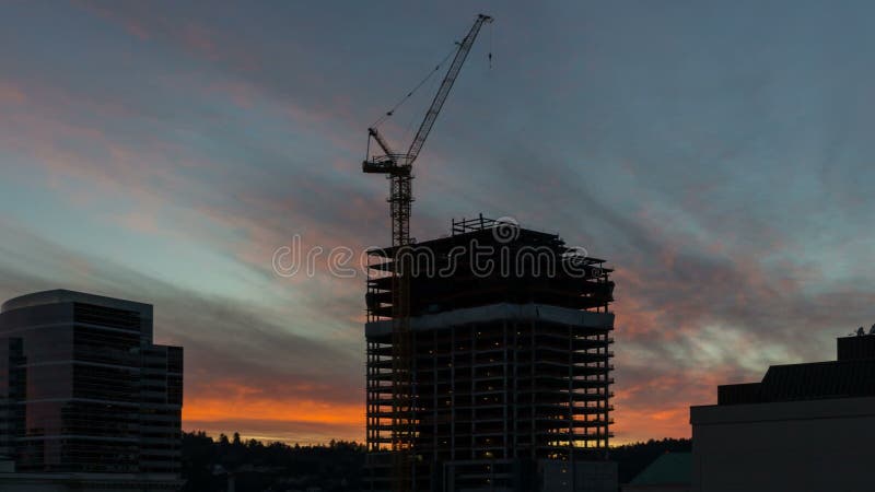 Time Lapse Movie of Colorful Fiery Sunset Over New Building Construction Site in Downtown Portland Oregon 1080p