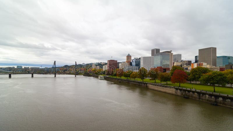 Time lapse of moving clouds over downtown city skyline of Portland Oregon along Willamette River 4k