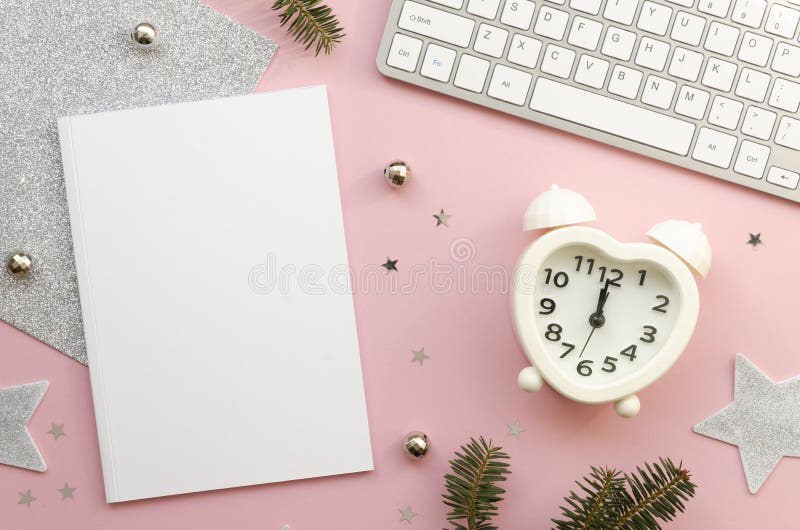 Time management concept. Blank notebook mockup. Alarm clock heart shaped. Keyboard and decorative branch on white