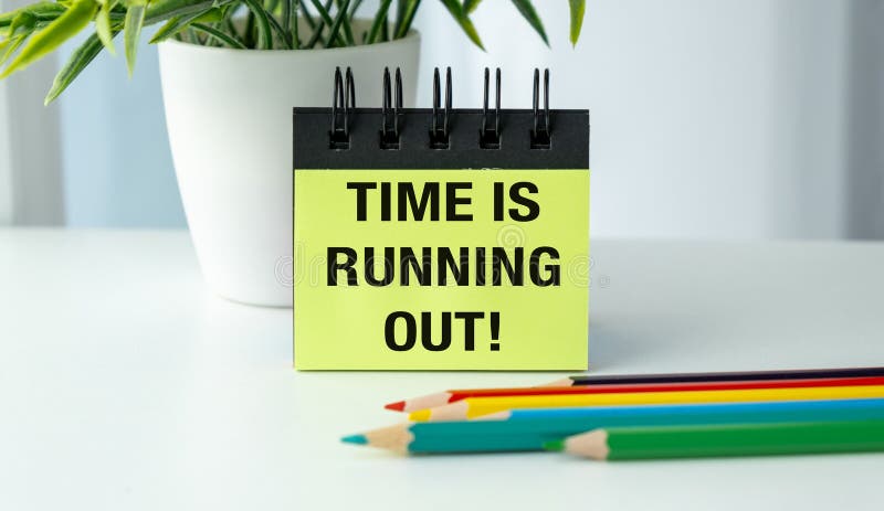 Time is Running Out text on notepad with colored pencils on office desk, Business Concept. Desk business concept stock images, royalty-free photos and pictures