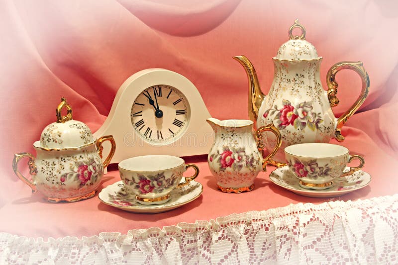 Time for tea!. Photo of a country tea shop window display, showing a beautiful vintage ornate tea set and clock set at eleven..that can only mean one thing..time royalty free stock images Time for tea!. Photo of a country tea shop window display, showing a beautiful vintage ornate tea set and clock set at eleven..that can only mean one thing..time royalty free stock images