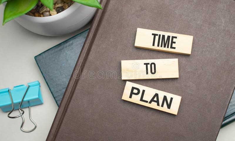 TIME TO PLAN. Conceptual image. text on wood cubes. text in black letters on wood blocks royalty free stock image