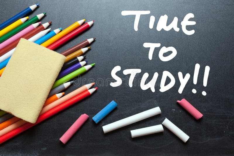 Time to study. School tools around. Blackboard background royalty free stock image