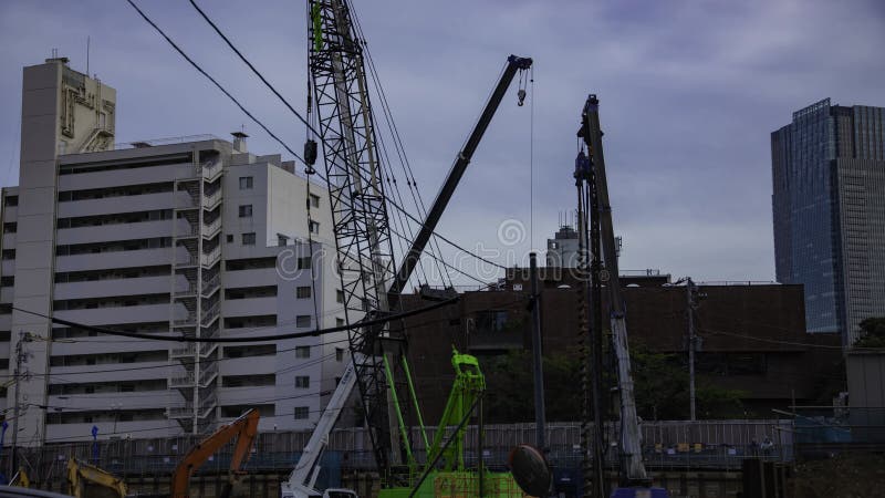 A timelapse of moving crane at the under construction in Tokyo stock video