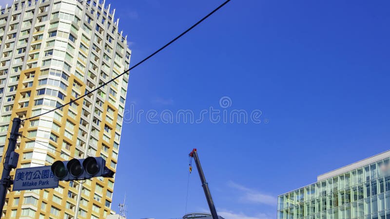 A timelapse of moving cranes at the under construction in Tokyo zoom stock video
