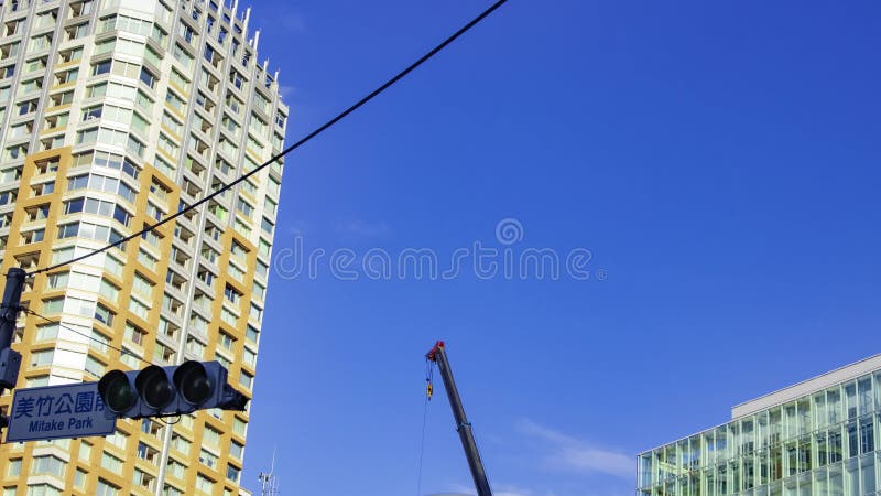 A timelapse of moving cranes at the under construction in Tokyo zoom stock video