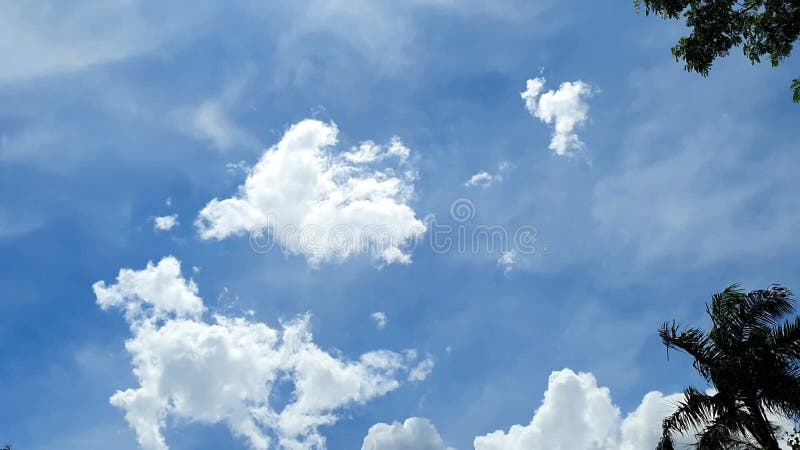 Timelapse of White Clouds Moving in a Bright Blue Sky Stock Video