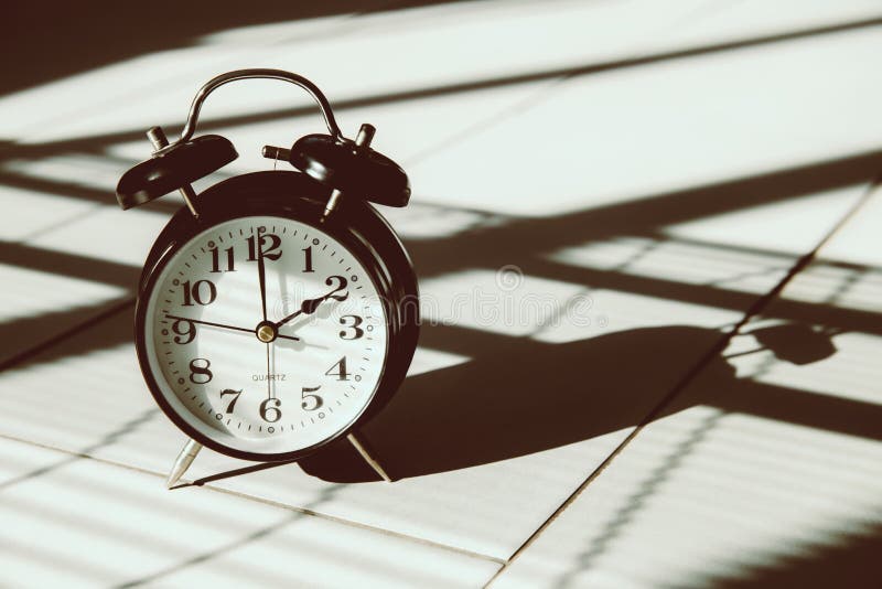 Times vintage clock in shade light and shadow art still life