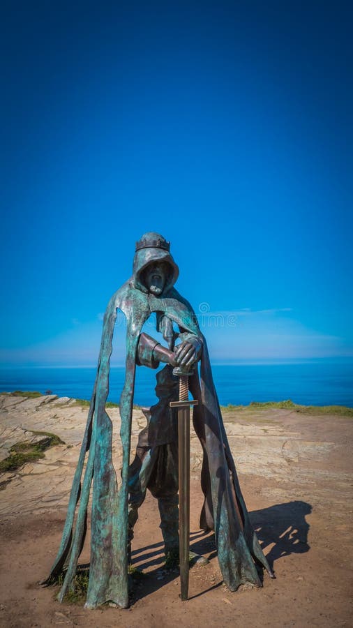 King Arthur sculpture with beautiful Cornish landscape in Tintagel, UK