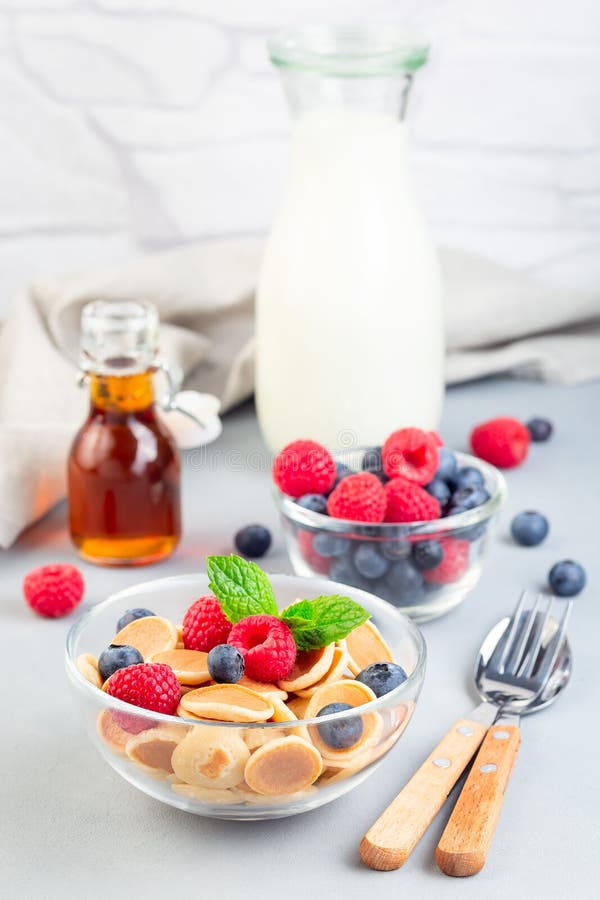 Tiny Cereal Pancakes Served with Maple Syrup, Raspberry, Blueberry and