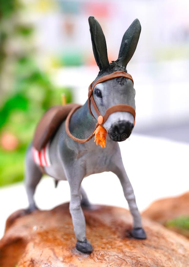 Tiny decorative and colorful figurine of a donkey stock images Tiny decorative and colorful figurine of a donkey stock images