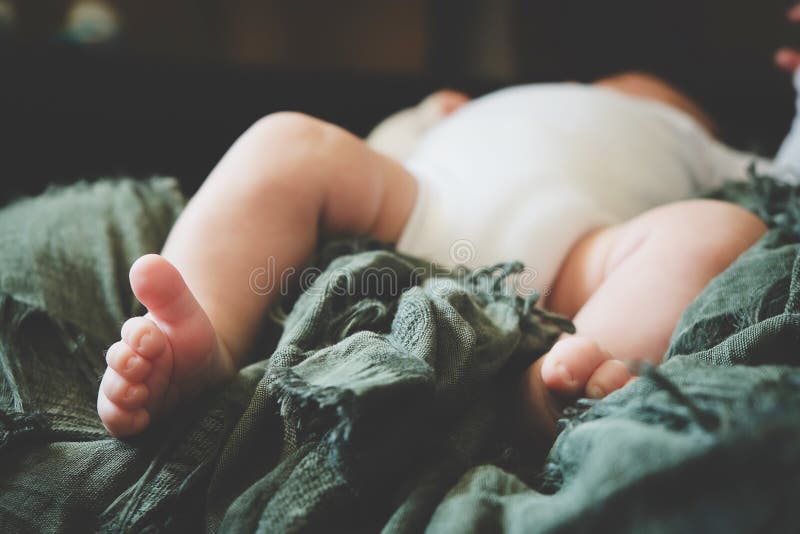 Tiny feet of newborn baby. Foots of infant. royalty free stock photography