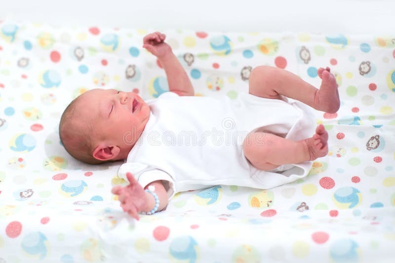 Sweet Newborn Baby Boy in Swing on a Sheepskin Stock Image Image of