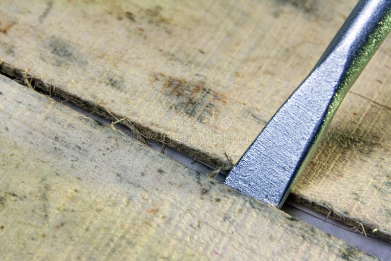 The Tip of the Mounting Tool is Inserted into the Slot between the