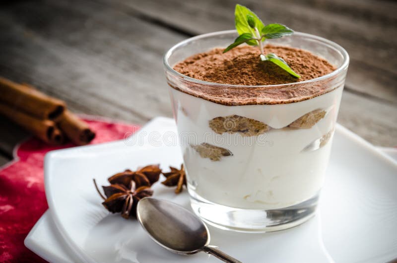 Tiramisu in the glass on the wooden background stock images Tiramisu in the glass on the wooden background stock images