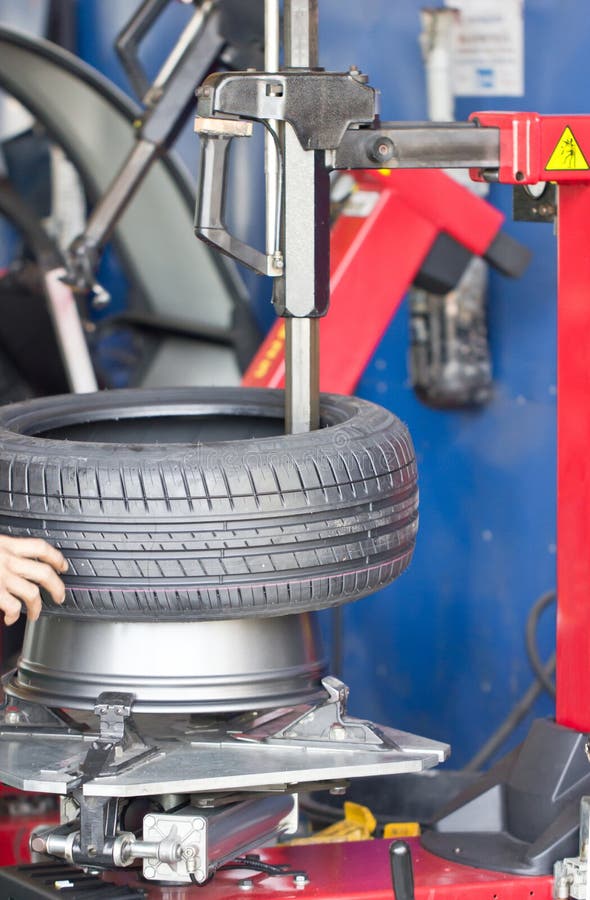 Tyre fitting machine stock photo. Image of automotive 33400718