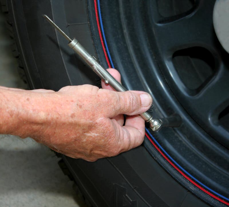 Tire pressure check. stock photo. Image of pressure, automobile 18903970