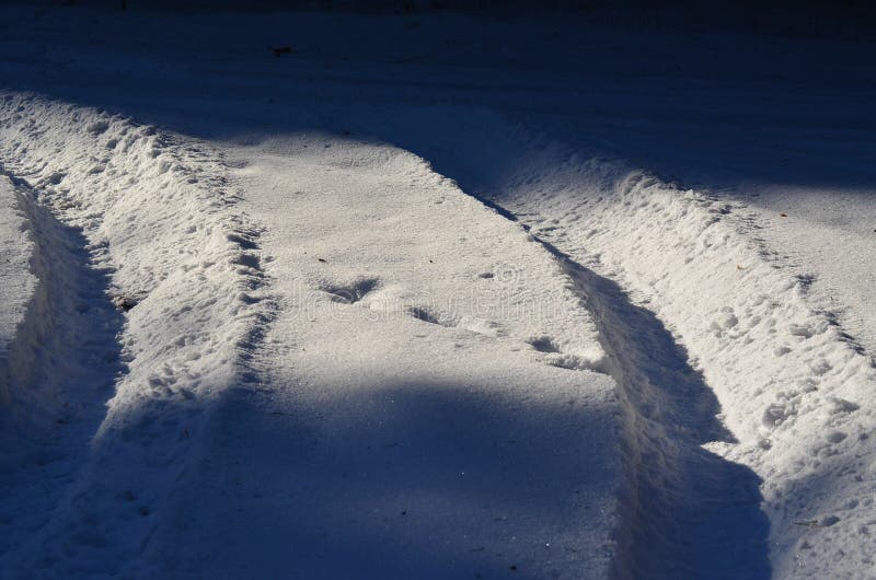 Tire tracks in the snow stock photo. Image of wheel, country 84770154