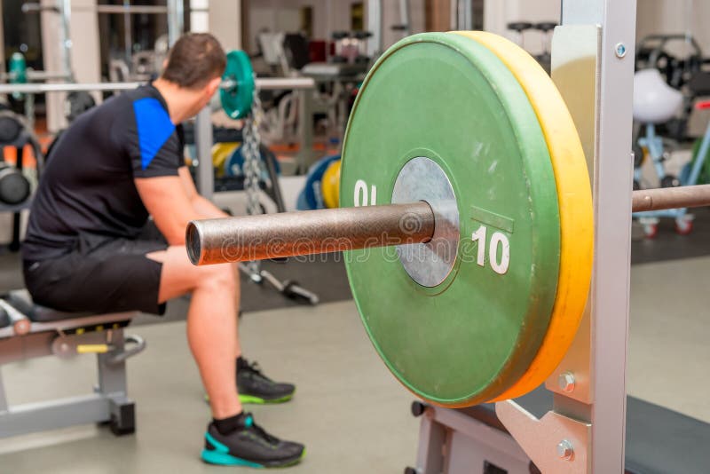 Tired athlete resting on a bench stock images Tired athlete resting on a bench stock images