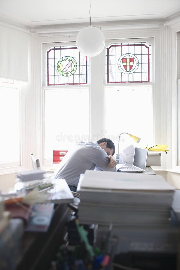 Woman Sitting At Table With Growing Stack Of Coins Under A Money Rain ...