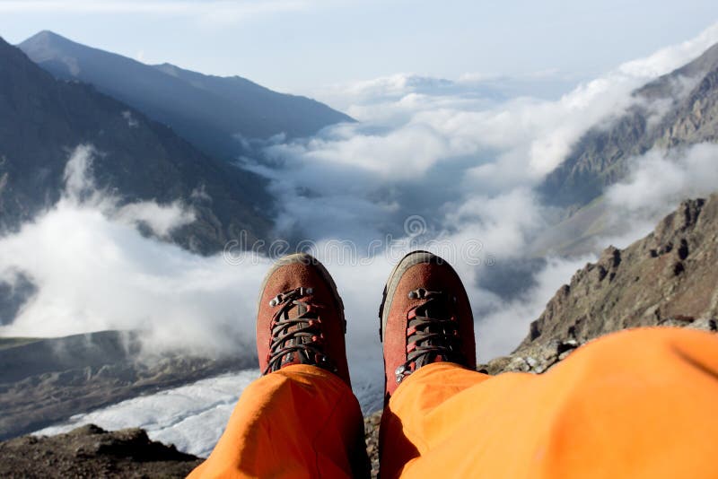 Tired Feet of the Climber in the Shoes on Mountains. Stock Image