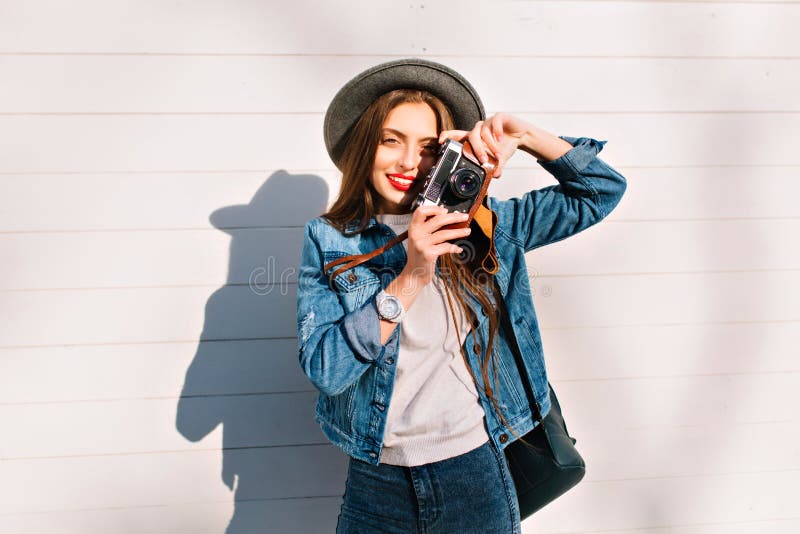 Tired Female Photographer in Trendy Denim Outfit Takes Latest Pictures  Standing Outside. Portrait of Charming Brunette Stock Photo - Image of  background, model: 153355662