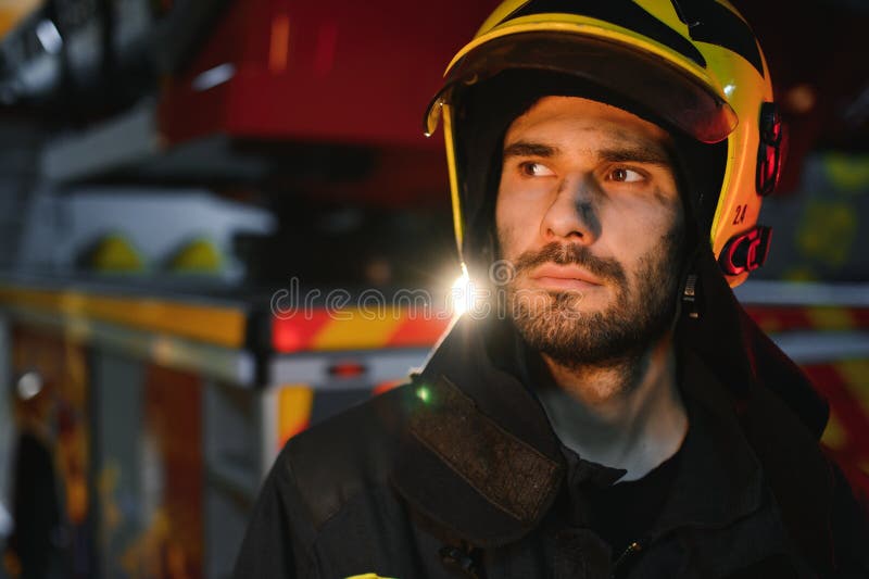 Tired Firefighter after Work in a Fire Department Stock Photo Image